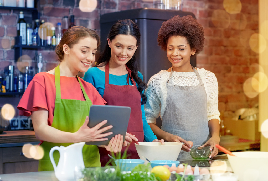 Happy Women with Tablet Pc Cooking 